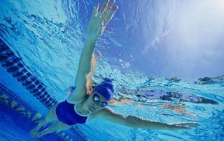 Swimming for fitness woman